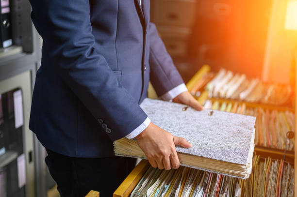 istock Working women manage to find office documents 1176763484