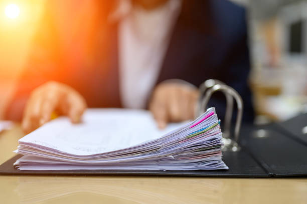 istock Working women manage to find office documents 1176763637