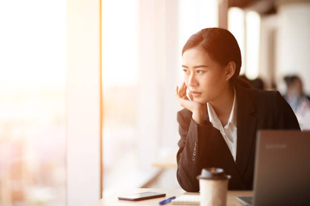 istock Working women sitting stressed about work at the office 1176763961