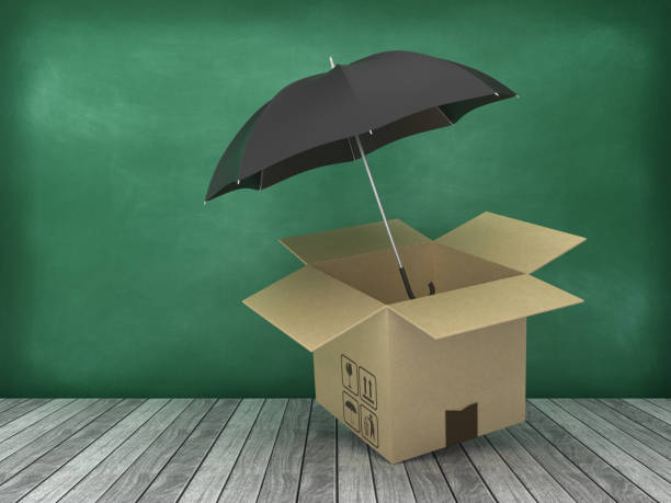 istock Cardboard Box with Umbrella on Wood Floor - Chalkboard Background - 3D Rendering 1176764136