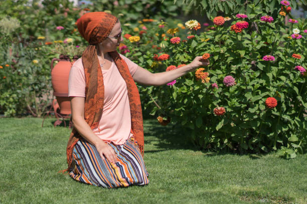 Modern Muslim women in backyard gardening.