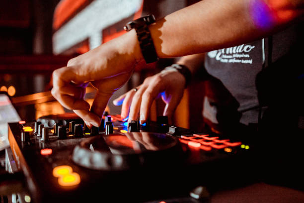 istock DJ in the club for the remote mixer 1176767362