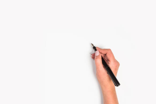 istock Female hands hold a pen. Isolated on white background. copy space, template. 1176771762