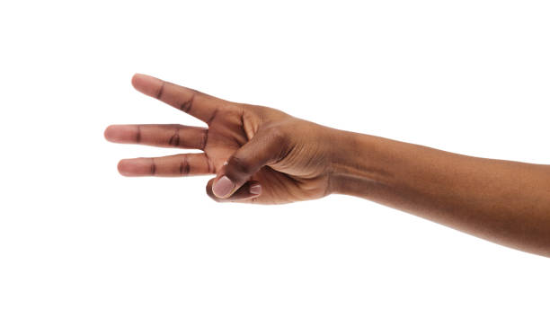 istock Black female hand showing three fingers, counting on white background 1176772085