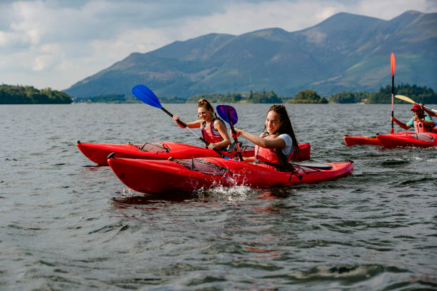 istock Friends Having a Kayak Race on a Lake 1176774039