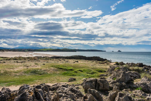 istock view of the beach with rocks and sand between cliffs 1176775652