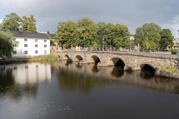 istock Old stone bridge on sunny day with rainbow. 1176775712