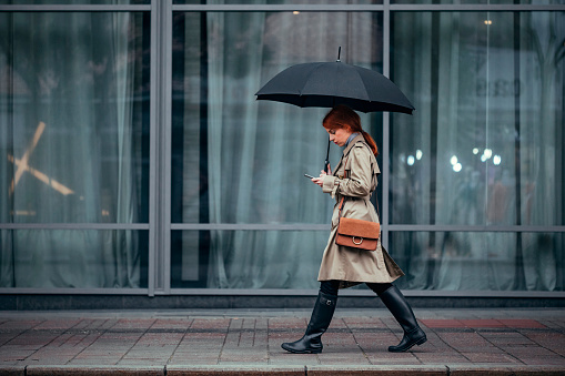A Woman Walking with Umbrella