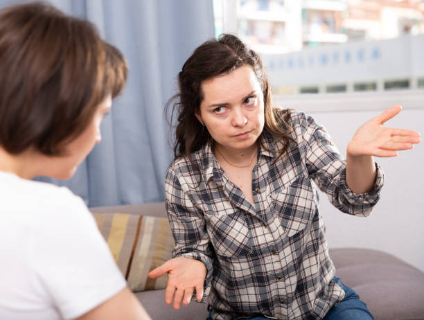 istock Woman pointing to mistakes to her elderly  sister while quarrel 1176776392