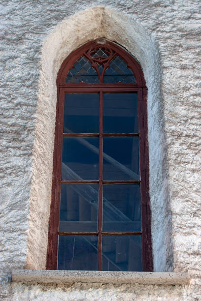 istock Window with a red wooden frame at the old church. 1176777693