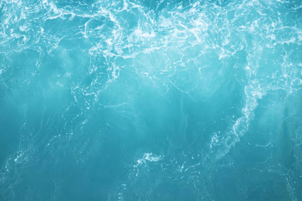 Sea Waves in ocean wave Splashing Ripple Water. Blue water background. Leave space to write descriptive text.