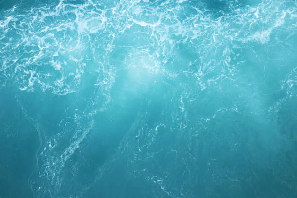 istock Sea Waves in ocean wave Splashing Ripple Water. Blue water background. Leave space to write descriptive text. 1176778923