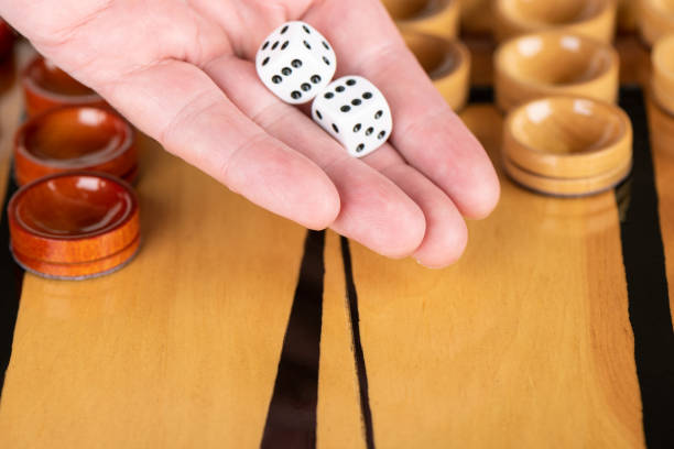 istock Game dice in the human palm. Close up. 1176781668