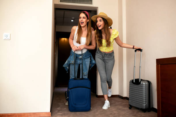 istock Best friends entering their hotel room 1176785059