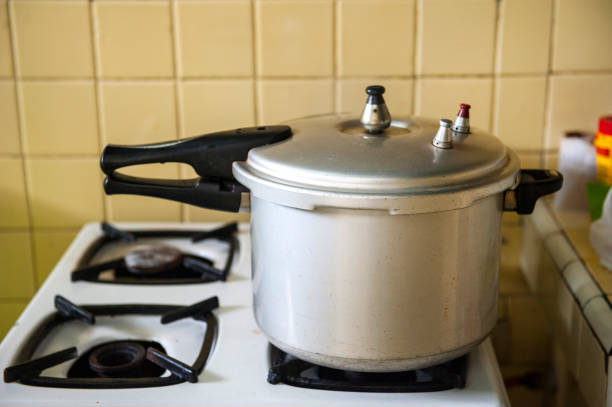 Pressure cooker on oven kitchen stock photo