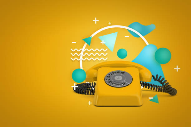 istock 3d rendering of a yellow rotary phone on a yellow background with white and blue geometric figures. 1176786708