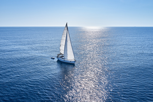 Sailboat during sailing. High angle view photo from drone DJI Mavic 2 Pro (Hasselblad camera).