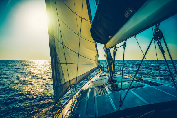 Sailing with sailboat at sunset, Dalmatia, Croatia.