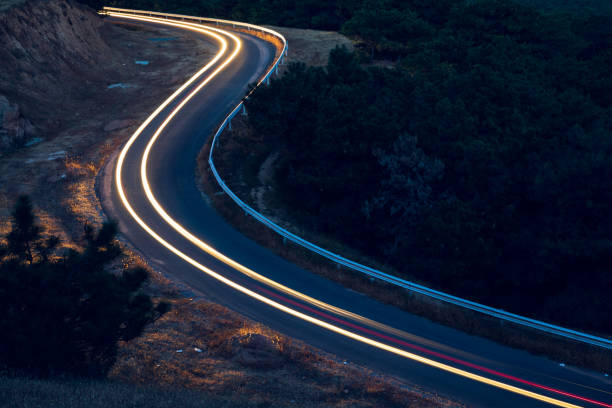 istock Colorful car tracks at night 1176791869