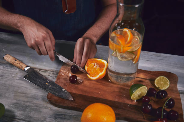 istock Young chef in kitchen preparing healthy juice. Food concept. 1176792118