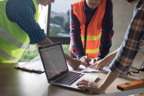istock team of engineer planing and working with laptop and blue print on working table in construction site 1176792213