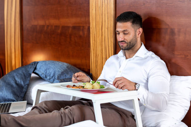 istock Young gentleman having a meal in bed 1176792392