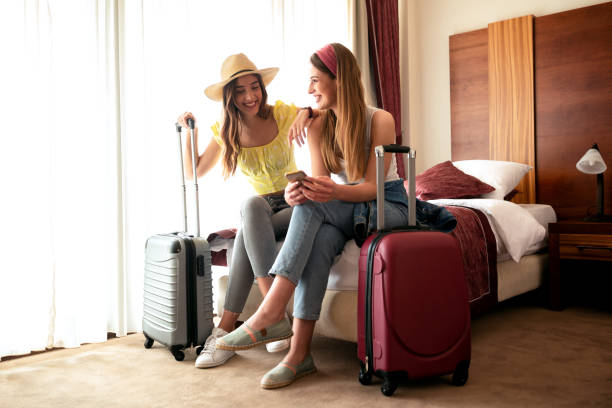 Traveling girls resting in a hotel room Traveling girls resting in a hotel room and having fun hostel photos stock pictures, royalty-free photos & images