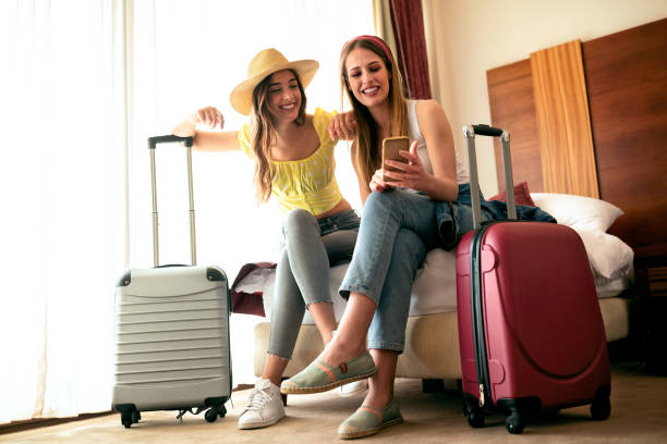 Sexy traveling girls and their luggage Sexy traveling girls and their luggage in a hotel room hostel photos stock pictures, royalty-free photos & images