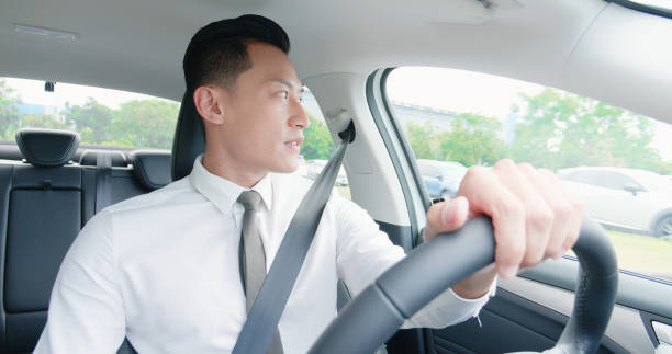 istock business asian man driving car 1176799389