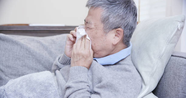 istock asian elderly  sick man sneeze 1176799452