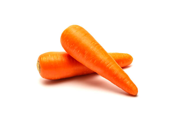 Fresh carrots isolated on white background. Close up of Carrots. stock photo