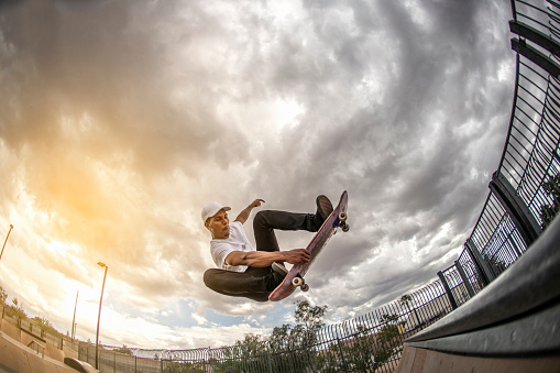 Skateboarding trick. Photographed using the Canon EOS 1DX mark II and the 15mm fisheye lens