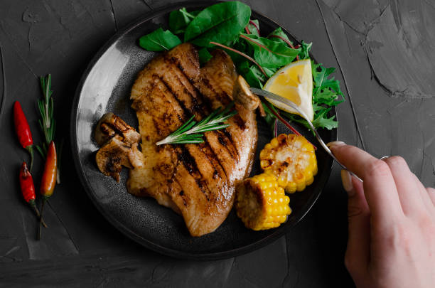 istock Grilled Fish Fillet with BBQ Vegetables and herbal 1176802330