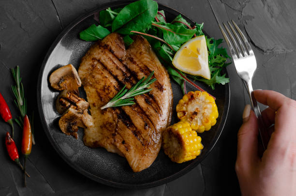 istock Grilled Fish Fillet with BBQ Vegetables and herbal 1176802359