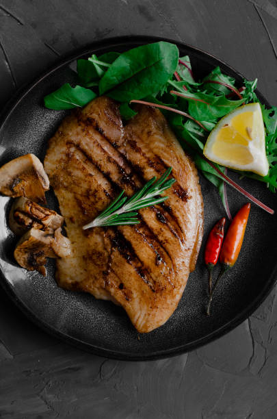istock Grilled Fish Fillet with BBQ Vegetables and herbal 1176802445