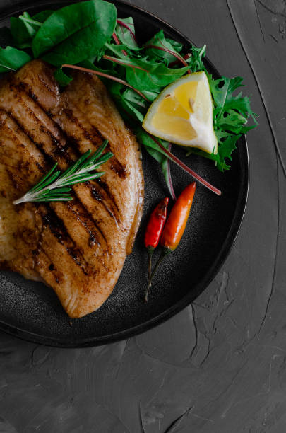 istock Grilled Fish Fillet with BBQ Vegetables and herbal 1176802453
