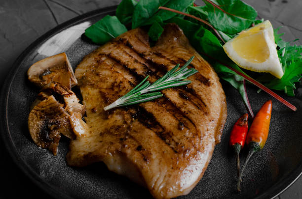 istock Grilled Fish Fillet with BBQ Vegetables and herbal 1176802475