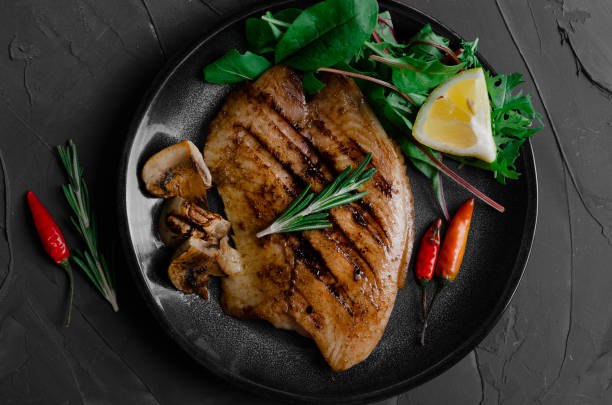 istock Grilled Fish Fillet with BBQ Vegetables and herbal 1176802503