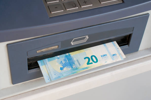 istock Euro banknotes dispensed from an ATM machine (bancomat) 1176802656