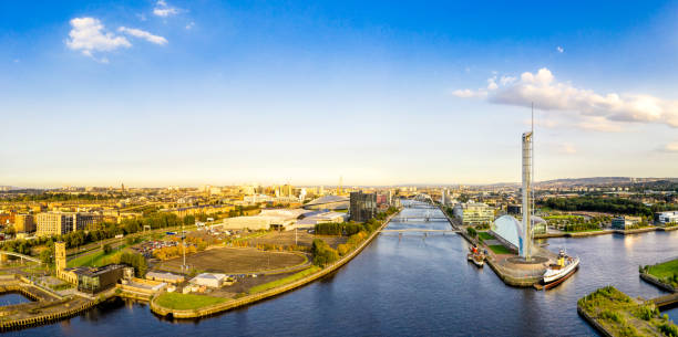 Glasgow city panorama - evening sunshine Sunshine on Glasgow's cityscape, as seen from over the Clyde. clyde river stock pictures, royalty-free photos & images