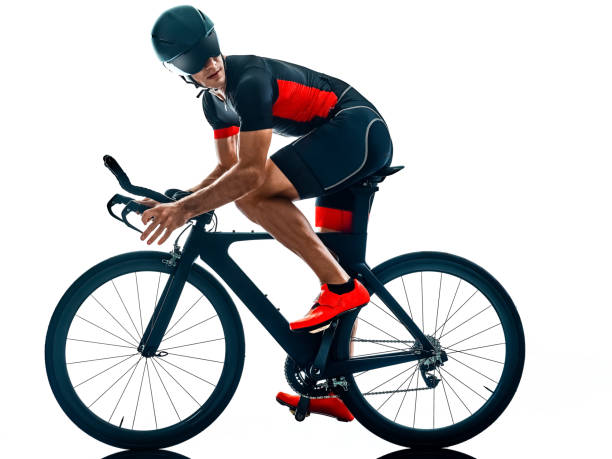 istock triathlete triathlon Cyclist cycling silhouette isolated white background 1176806238