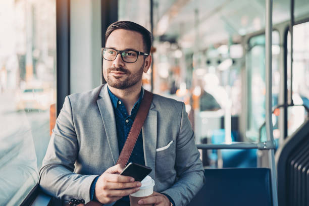 Businessman traveling with a bus