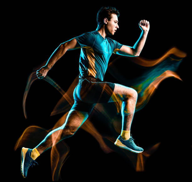 istock runner running jogger jogging man isolated light painting black background 1176806715