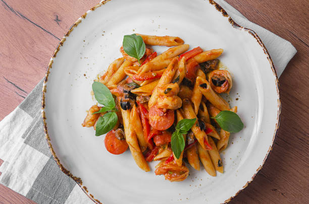 istock Italian Pasta with shrimp in tomato sauce 1176807694
