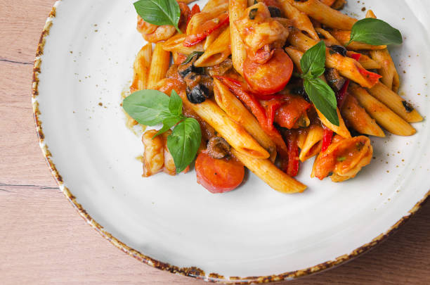 istock Italian Pasta with shrimp in tomato sauce 1176807740