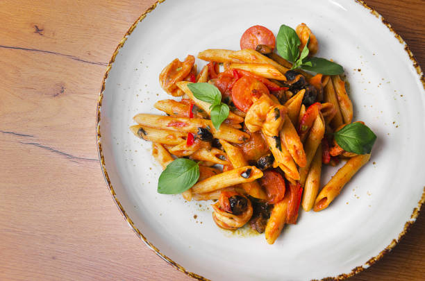 istock Italian Pasta with shrimp in tomato sauce 1176807748
