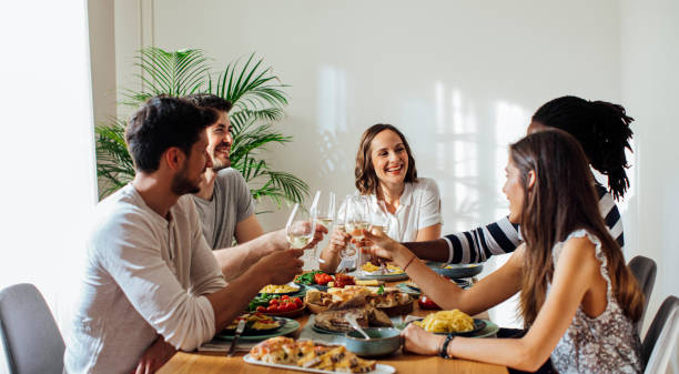 istock Friends Celebrating and Rising Wine Glasses 1176808190