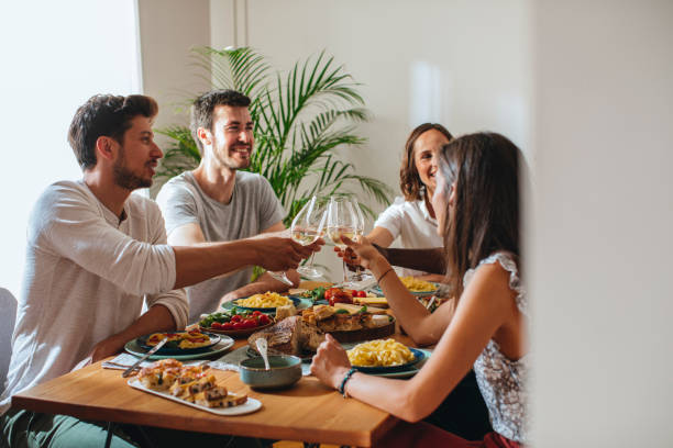 istock Friends Celebrating and Rising Wine Glasses 1176808193