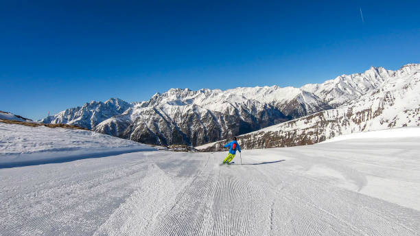 istock Heiligenblut - A skier going down a perfectly roomed slope 1176808443