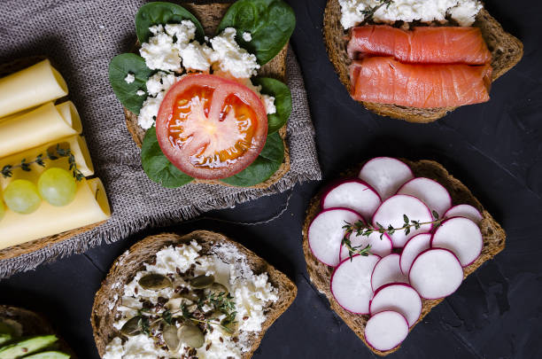 istock sandwiches with various fillings: ham, cheese, avocado, sauce 1176808793
